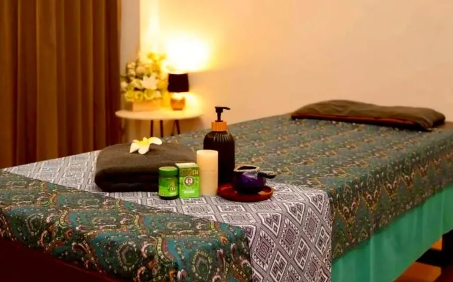 Aroma oil, candle and flower prepared for the Ingsuk Calm Ritual